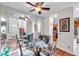 Elegant dining room with a glass table and mirrored accent wall at 1050 Starkey Rd # 2701, Largo, FL 33771