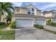 Two-story townhome with double garage and landscaped yard at 1050 Starkey Rd # 2701, Largo, FL 33771