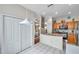 Open kitchen with granite island and stainless steel appliances at 1050 Starkey Rd # 2701, Largo, FL 33771