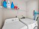 Convenient laundry room with washer, dryer, and shelving at 1050 Starkey Rd # 2701, Largo, FL 33771
