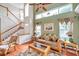 Bright living room with vaulted ceiling, hardwood floors, and comfy seating at 1050 Starkey Rd # 2701, Largo, FL 33771