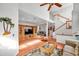 Two-story living room with hardwood floors, staircase, and open floorplan at 1050 Starkey Rd # 2701, Largo, FL 33771