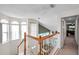 Upstairs hallway offering views into living areas and bedrooms at 1050 Starkey Rd # 2701, Largo, FL 33771