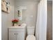 Clean bathroom with white vanity, toilet and shower at 10926 N Lantana Ave, Tampa, FL 33612