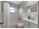 Clean bathroom with a tub, toilet, and vanity at 10926 N Lantana Ave, Tampa, FL 33612