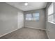 Bedroom with window, closet, and ceiling fan at 10926 N Lantana Ave, Tampa, FL 33612