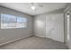 Spacious bedroom with neutral walls, carpet, and ceiling fan at 10926 N Lantana Ave, Tampa, FL 33612