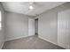 Simple bedroom with carpet and neutral walls at 10926 N Lantana Ave, Tampa, FL 33612