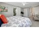 Main bedroom with ensuite bathroom and ceiling fan at 10926 N Lantana Ave, Tampa, FL 33612