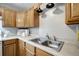 Kitchen sink and wood cabinets at 10926 N Lantana Ave, Tampa, FL 33612