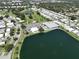 Aerial view of Fairway Village community with lake and homes at 1100 Belcher S Rd # 190, Largo, FL 33771