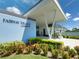 Fairway Village Clubhouse entrance with landscaping at 1100 Belcher S Rd # 190, Largo, FL 33771