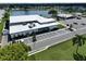 Aerial view of community center, parking lot, and lake at 1100 Belcher S Rd # 190, Largo, FL 33771