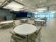 Large community room with tables and chairs at 1100 Belcher S Rd # 190, Largo, FL 33771