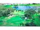 Aerial view of lush green golf course and pond at 1100 Belcher S Rd # 190, Largo, FL 33771