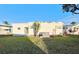 White single wide home with a grassy backyard and AC unit at 1100 Belcher S Rd # 190, Largo, FL 33771