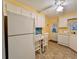 View of kitchen appliances and a small dining area at 1100 Belcher S Rd # 190, Largo, FL 33771