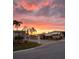 Residential street lined with manufactured homes at sunset at 1100 Belcher S Rd # 190, Largo, FL 33771