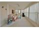 Sunroom boasts ample natural light and relaxing seating at 1100 Belcher S Rd # 190, Largo, FL 33771