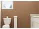 Bathroom with toilet and white vanity at 11176 Wishing Cloud Rd, Land O Lakes, FL 34638