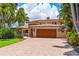 Two-story home with a large driveway at 1124 Seville Ne Ln, St Petersburg, FL 33704