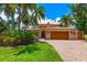 Two-story house with lush landscaping at 1124 Seville Ne Ln, St Petersburg, FL 33704