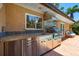 Outdoor kitchen featuring stainless steel appliances, a sink, and a grill at 1124 Seville Ne Ln, St Petersburg, FL 33704