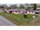 Single-story home with large backyard, detached building, and chain link fence at 12002 Washington St, Seffner, FL 33584