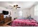 Well-lit bedroom with two twin beds and ceiling fan at 12002 Washington St, Seffner, FL 33584