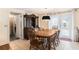 Dining room with wooden table and chairs, hutch, and access to kitchen at 12002 Washington St, Seffner, FL 33584