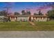 Charming ranch house with a well-maintained lawn at 12002 Washington St, Seffner, FL 33584