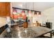 Modern kitchen with granite countertops and stainless steel appliances at 12002 Washington St, Seffner, FL 33584