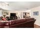 Open concept living room and dining area with hardwood floors at 12002 Washington St, Seffner, FL 33584