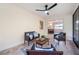 Relaxing screened porch with wicker furniture and ceiling fan at 1291 Golden Oak Dr, Tarpon Springs, FL 34689