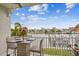 Peaceful balcony with water views and bistro table at 145 Brightwater Dr # 2, Clearwater, FL 33767