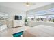 Bedroom with large windows, dresser, and ocean view at 145 Brightwater Dr # 2, Clearwater, FL 33767