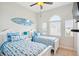 Bright bedroom with two twin beds and ocean-themed bedding at 145 Brightwater Dr # 2, Clearwater, FL 33767
