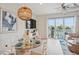 Modern dining area with glass table, and water views at 145 Brightwater Dr # 2, Clearwater, FL 33767
