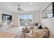 Spacious living room with water views and comfy seating at 145 Brightwater Dr # 2, Clearwater, FL 33767
