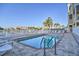 Community pool with lounge chairs and waterfront views at 145 Brightwater Dr # 2, Clearwater, FL 33767