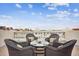 Rooftop patio furniture with city views and granite table at 145 Brightwater Dr # 2, Clearwater, FL 33767