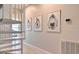 Modern white spiral staircase with coastal art at 145 Brightwater Dr # 2, Clearwater, FL 33767