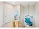 Upstairs hallway with large wave painting and chandelier at 145 Brightwater Dr # 2, Clearwater, FL 33767