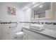 Clean bathroom with a modern vanity and marble tile at 1571 Jeffords St, Clearwater, FL 33756