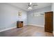 Simple bedroom with hardwood floors and a ceiling fan at 1571 Jeffords St, Clearwater, FL 33756