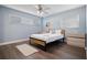Light and airy bedroom with a full-size bed and ceiling fan at 1571 Jeffords St, Clearwater, FL 33756