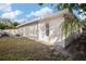 Gray house exterior showcasing a back patio and additional space at 1571 Jeffords St, Clearwater, FL 33756