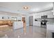 Open concept kitchen with island, stainless steel appliances, and granite countertops at 1571 Jeffords St, Clearwater, FL 33756