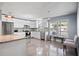 Modern kitchen with white cabinets, stainless steel appliances, and granite countertops at 1571 Jeffords St, Clearwater, FL 33756