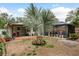 Spacious backyard with patio, palm tree, and shed at 1611 San Charles Dr, Dunedin, FL 34698